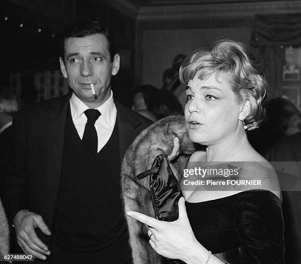 Simone Signoret and Yves Montand at Maxim's.