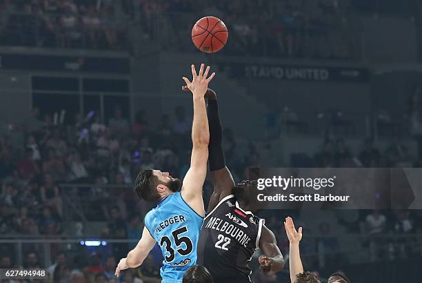 Alex Pledger of the New Zealand Breakers and Majok Majok of Melbourne United compete for the ball during the round nine NBL match between Melbourne...