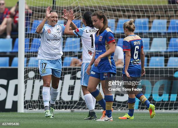 Kyah Simon of Sydney celebrates with team mate Leena Khamis during the round five W-League match between the Newcastle Jets and Sydney FC at McDonald...