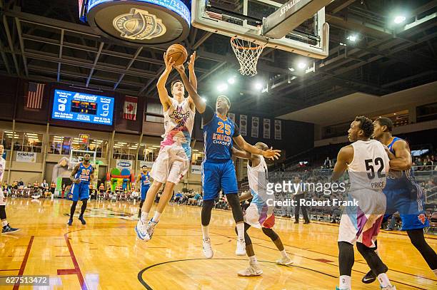 Steven Zimmerman of the the Erie BayHawks has the ball stripped by Damien Inglis of the Westchester Knicks in a game against the Westchester Knicks...