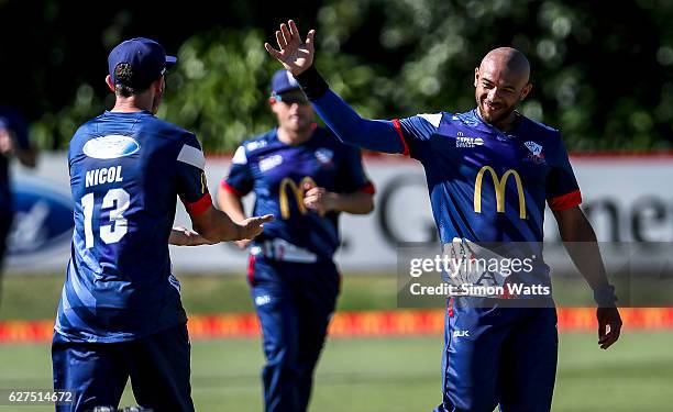 Tymal Mills of Auckland celebrates a wicket during the McDonalds Super Smash T20 match between the Auckland Aces and Otago Volts at Eden Park on...