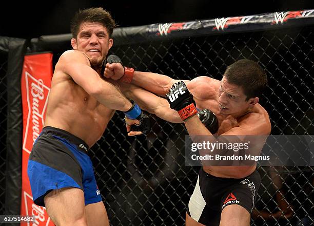 Joseph Benavidez punches Henry Cejudo in their flyweight bout during The Ultimate Fighter Finale event inside the Pearl concert theater at the Palms...