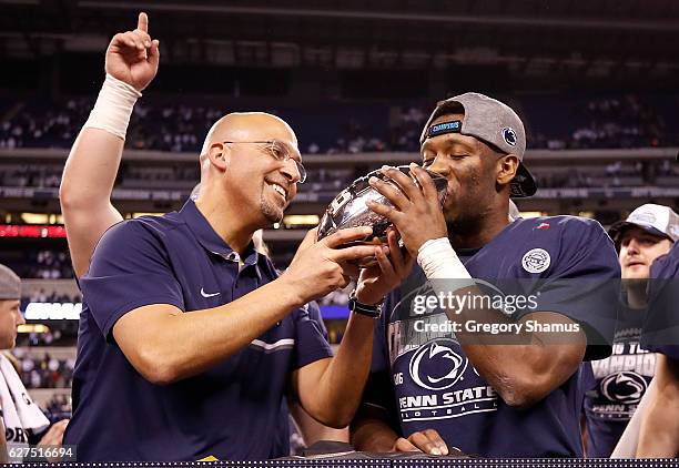 James Franklin, head coach of the Penn State Nittany Lions, and Malik Golden of the Penn State Nittany Lions celebrate with the Big Ten Championship...