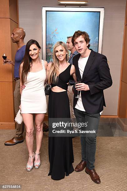 Isabelle Dominguez De Haro poses with guests attends Underwater Dreams To Life In Color - Art Exhibit Featuring Antonio Dominguez De Haro And Romero...