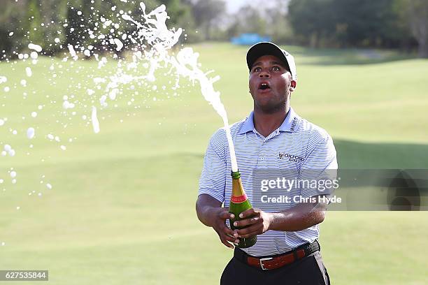 Harold Varner III of the USA celebrates after winning the Joe Kirkwood trophy on day four of the 2016 Australian PGA Championship at RACV Royal Pines...