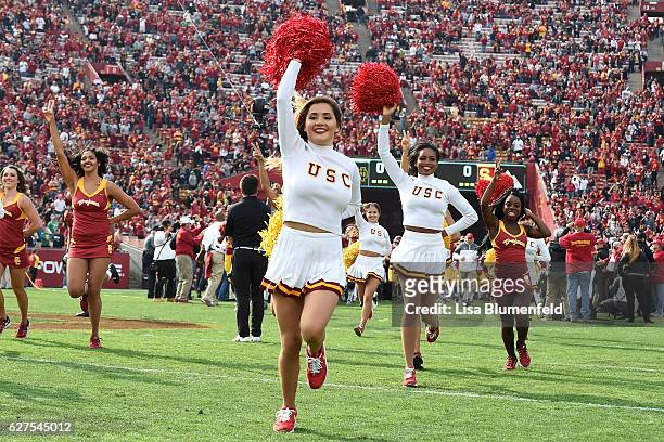 The USC Trojans cheerleaders run on to the field befoe the game against the Notre Dame Fighting Irish at Los Angeles Memorial Coliseum on November...