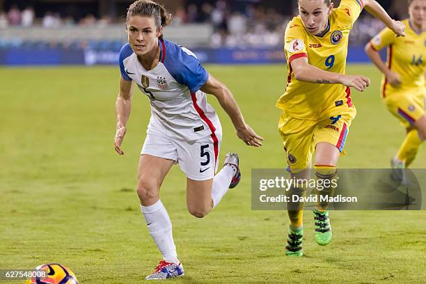 Kelley O'Hara of the USA plays in a soccer game against Romania on November 10, 2016 at Avaya Stadium in San Jose, California. Defending is Laura Rus...