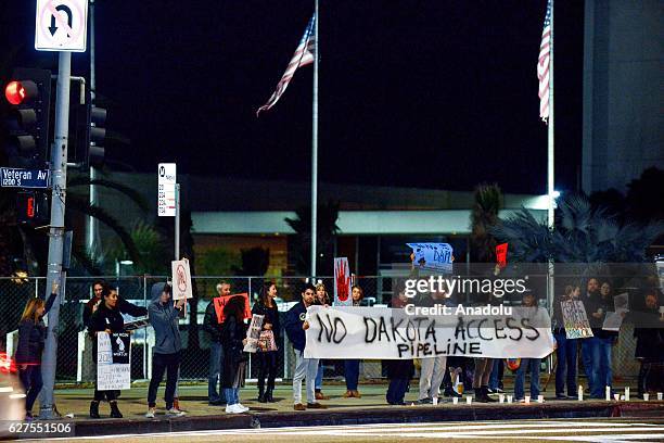 Activists attend a protest against Dakota Access Pipe Line in front of Federal Building in Westwood, Los Angeles on December 3, 2016.