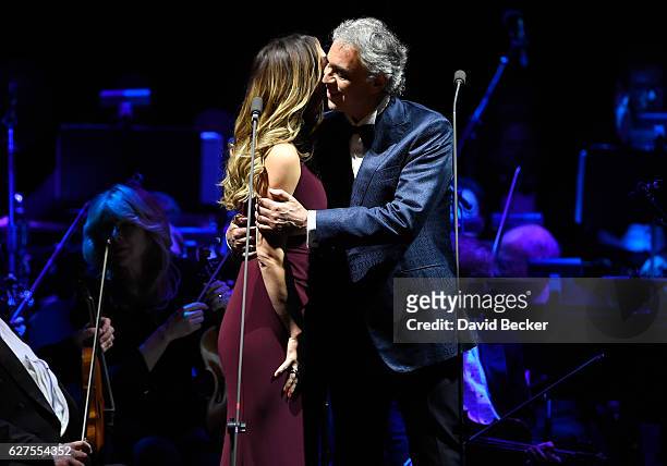 Singers Katharine McPhee and Andrea Bocelli embrace after performing a duet at MGM Grand Garden Arena as he kicks off his U.S. Tour on December 3,...