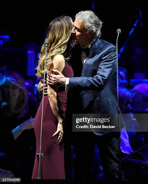 Singers Katharine McPhee and Andrea Bocelli embrace after performing a duet at MGM Grand Garden Arena as he kicks off his U.S. Tour on December 3,...