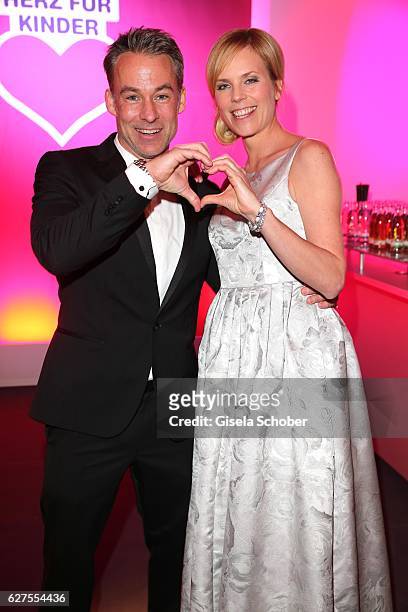 Marco Girnth and Melanie Marschke are seen during the Ein Herz Fuer Kinder reception at Adlershof Studio on December 3, 2016 in Berlin, Germany.