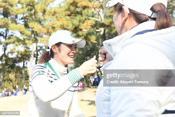 Yumiko Yoshida cheers Ayaka Watanabe of Japan on the 7th hole during the final round of the THE QUEENS Presented By KOWA at the Miyoshi Country Club...