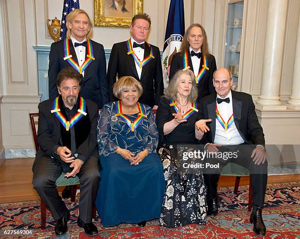 The recipients of the 39th Annual Kennedy Center Honors pose for a group photo following a dinner hosted by United States Secretary of State John...