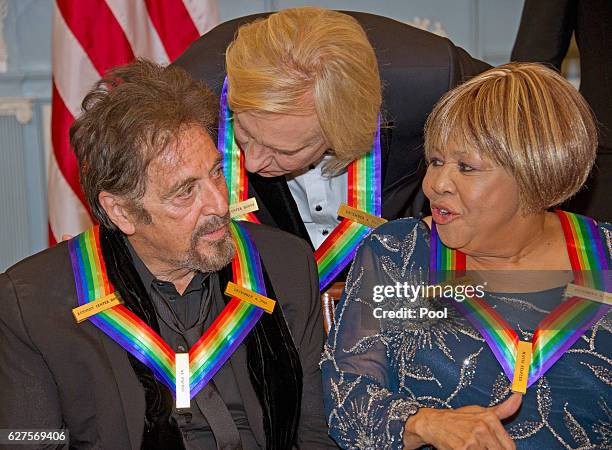 Al Pacino, left, one of the five recipients of the 39th Annual Kennedy Center Honors, gospel and blues singer Mavis Staples, right, and Joe Walsh of...