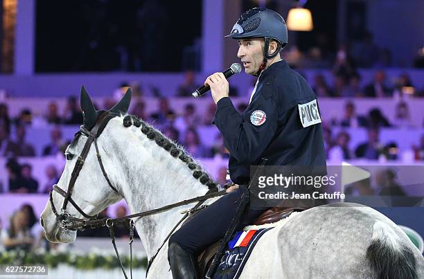 Nicolas Canteloup of France, as a policeman on strike, competes in the annual Pro-Am Charity show jumping event during the Paris Longines Masters...