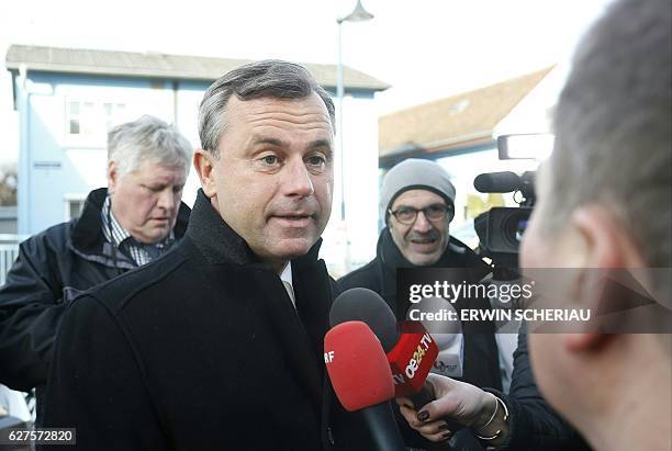 Austrian right-wing Freedom Party presidential candidate Norbert Hofer answers journelists as he arrives at a protestant church in Pinkafeld,...