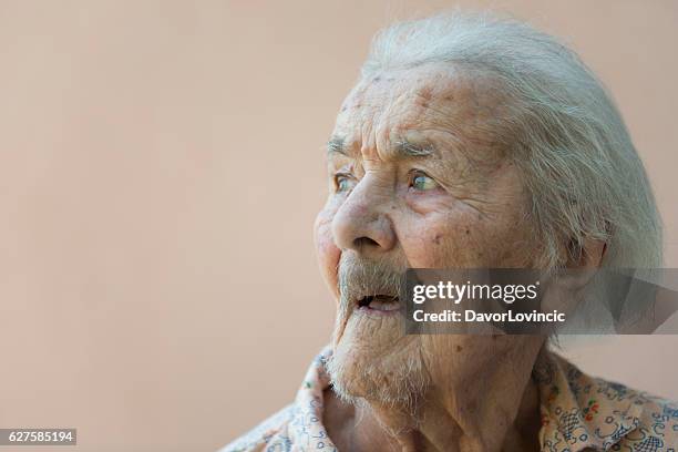 side view of an very  old lady - slavonia stock pictures, royalty-free photos & images