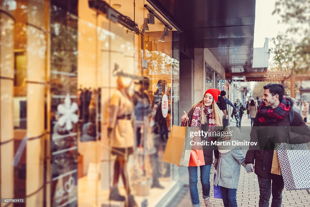 Young family shopping for Christmas