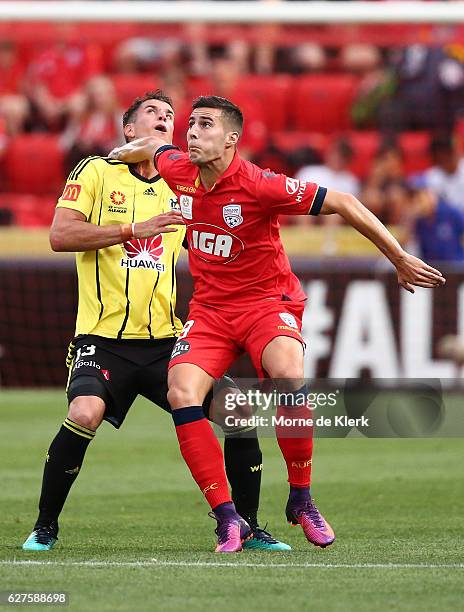 Sergio Guardiola of Adelaide United and Marco Rossi of Wellington Phoenix compete for the ball during the round nine A-League match between Adelaide...