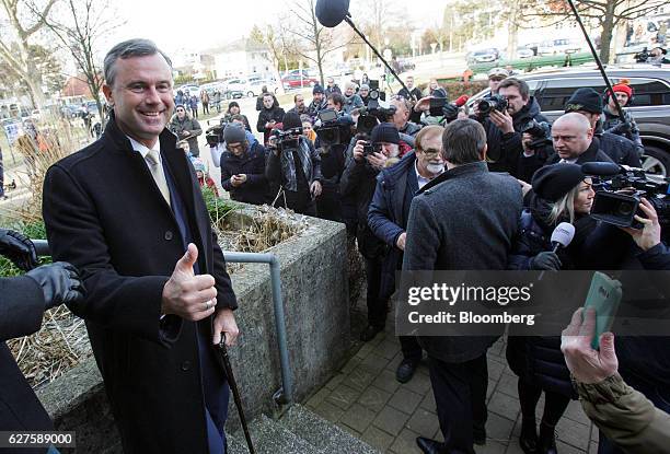 Norbert Hofer, presidential candidate of Austria's Freedom party, reacts in front of a polling station after casting his vote in Pinkafeld, Austria,...