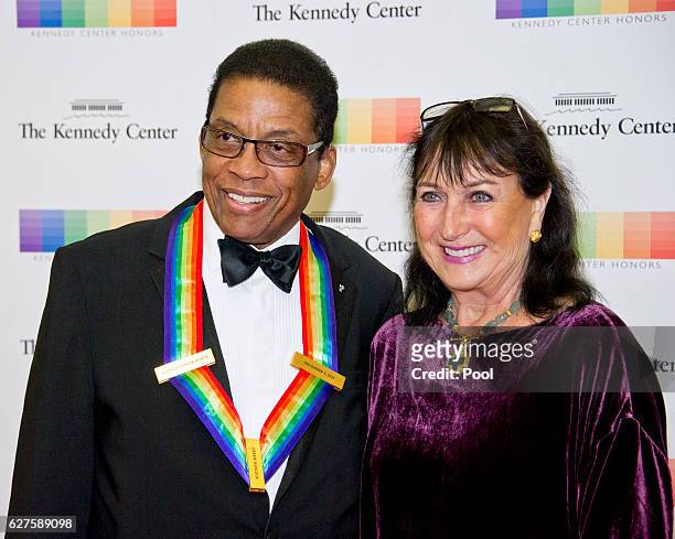 Kennedy Center Honor recipient Herbie Hancock and his wife, Gigi, arrives for the formal Artist's Dinner honoring the recipients of the 39th Annual...