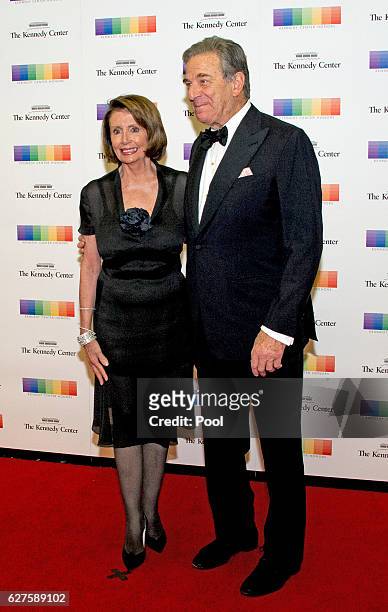 United States House Minority Leader Nancy Pelosi and her husband, Paul, arrive for the formal Artist's Dinner honoring the recipients of the 39th...