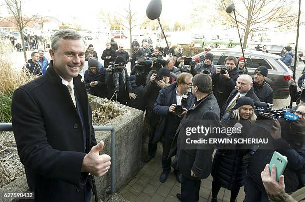Austrian far-right Freedom Party presidential candidate Norbert Hofer poses at a polling station after he casted his ballot in Pinkafeld, Austria on...