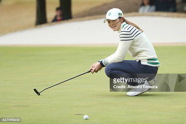 Ayaka Watanabe of Japan reacts after putting on the 17th green during the final round of the THE QUEENS Presented By KOWA at the Miyoshi Country Club...