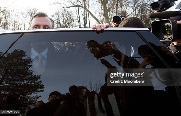 Norbert Hofer, presidential candidate of Austria's Freedom party, peers over a car window as he arrives at a polling station to cast his vote, in...