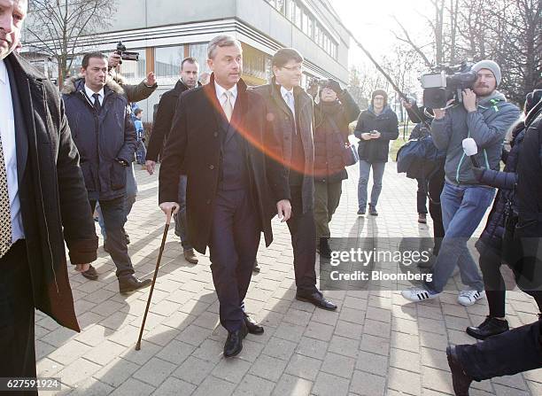 Norbert Hofer, presidential candidate of Austria's Freedom party, center left, leaves a polling station after casting his vote, in Pinkafeld,...
