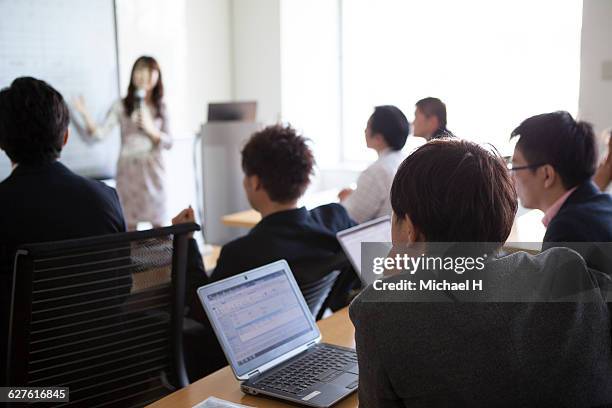 people watching presentation in conference room - セミナー　日本人 ストックフォトと画像