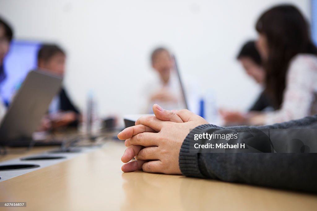 Close up hands in a modern office.