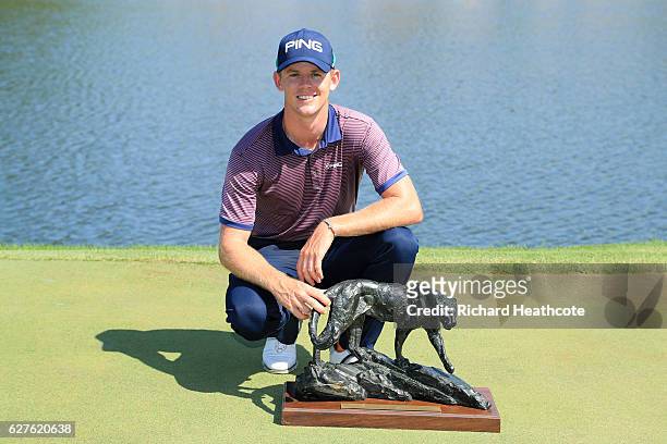 Brandon Stone of South Africa holds the winners trophy following victory during the final round of The Alfred Dunhill Championship at Leopard Creek...