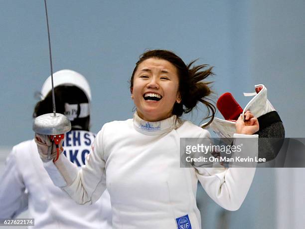 Chu Ka Mong of Hong Kong reacts after defeating Hsieh Kaylin Sin Yan of Hong Hong during Women's Epee final match in 2016 Hong Kong Fencing Open...