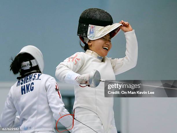 Chu Ka Mong of Hong Kong reacts after defeating Hsieh Kaylin Sin Yan of Hong Hong during Women's Epee final match in 2016 Hong Kong Fencing Open...