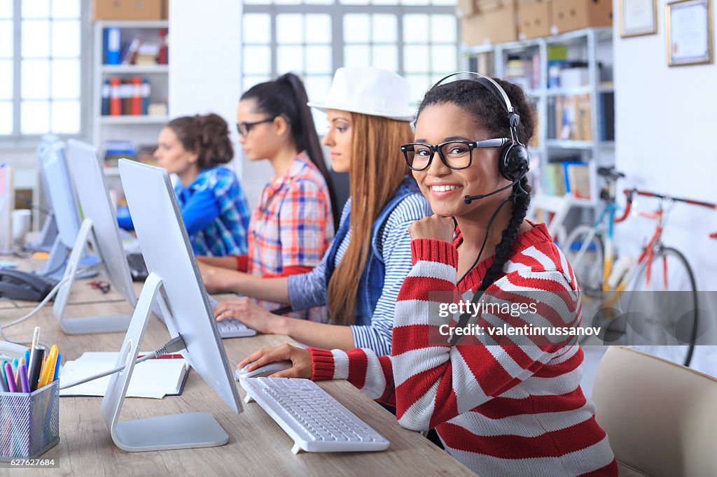 Female call centre team working at workplace