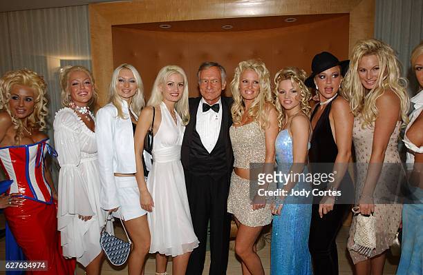 Hugh Hefner and his girlfriends arrive at the Warner Music Group and Entertainment Weekly post-Grammy party.