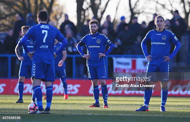 Curzon Ashton players look dejected during the Emirates FA Cup second round match between Curzon Ashton and AFC Wimbledon at Tameside Stadium on...