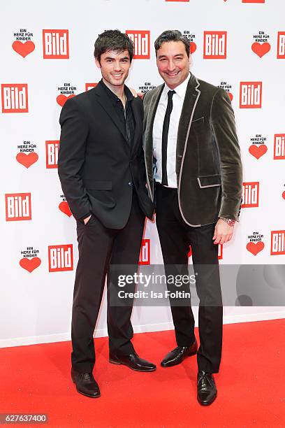 German actor Nik Xhelilaj and DJ Mousse T. Attend the Ein Herz Fuer Kinder gala on December 3, 2016 in Berlin, Germany.