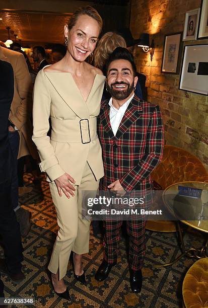 Amber Valletta and Johnny Coca attend The Fashion Awards in partnership with Swarovski nominees' lunch hosted by the British Fashion Council with...