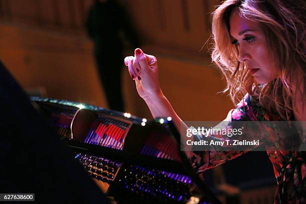 Presenter Myleene Klass rehearses at the piano before a performance of a selection of Grieg's Lyric Pieces during 'Word And Play Celebrity Christmas...