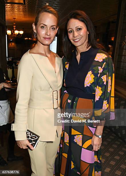 Amber Valletta and Caroline Rush attends The Fashion Awards in partnership with Swarovski nominees' lunch hosted by the British Fashion Council with...
