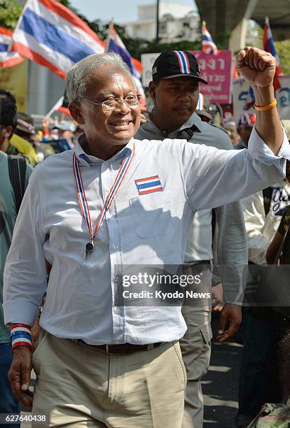 Thailand - Former Thai Deputy Prime Minister Suthep Thaugsuban, leader of antigovernment protests, waves to supporters while marching in central...