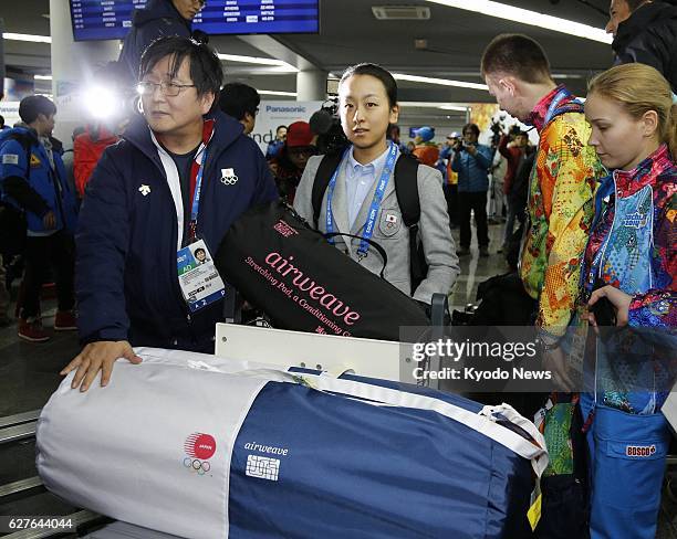 Russia - Japanese figure skater Mao Asada is pictured in the early hours of Feb. 6 after arriving at Sochi airport to compete in the Winter Olympics.