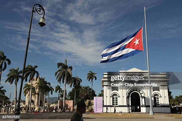 The Cuban flag flys at half staff after the remains of former Cuban President Fidel Castro arrived in the Cementerio Santa Ifigenia where he will be...