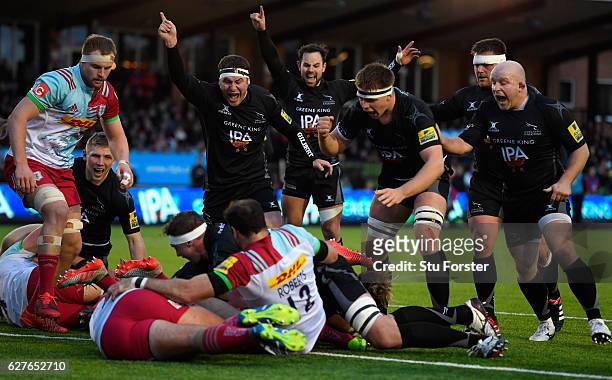 Falcons players Rob Vickers and Michael Young celebrate the try of Mark Wilson during the Aviva Premiership match between Newcastle Falcons and...
