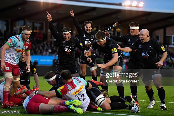 Falcons players Rob Vickers and Michael Young celebrate the try of Mark Wilson during the Aviva Premiership match between Newcastle Falcons and...