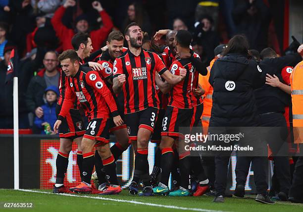 Steve Cook of AFC Bournemouth celebrates with team mates as Nathan Ake of AFC Bournemouth scores their fourth goal during the Premier League match...