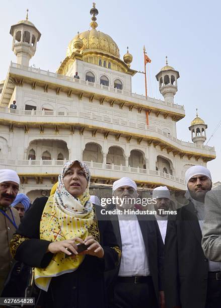 Iranian Foreign Minister Mohammad Javad Zarif and his wife Maryam Imanieh with delegation members paying obeisance at Golden Temple, on December 4,...