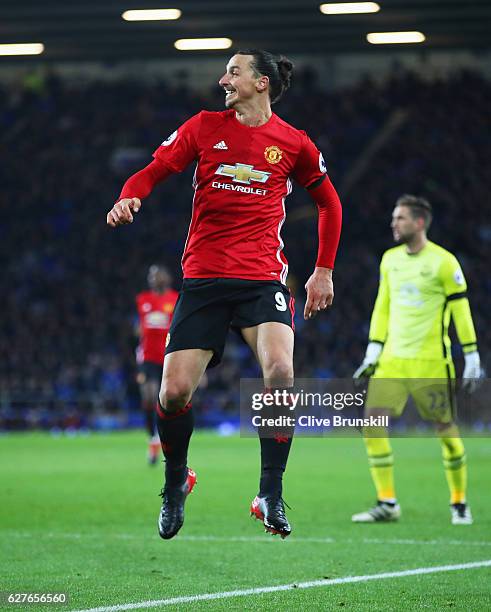 Zlatan Ibrahimovic of Manchester United looks on as he beats Maarten Stekelenburg of Everton as he scores their first goal during the Premier League...